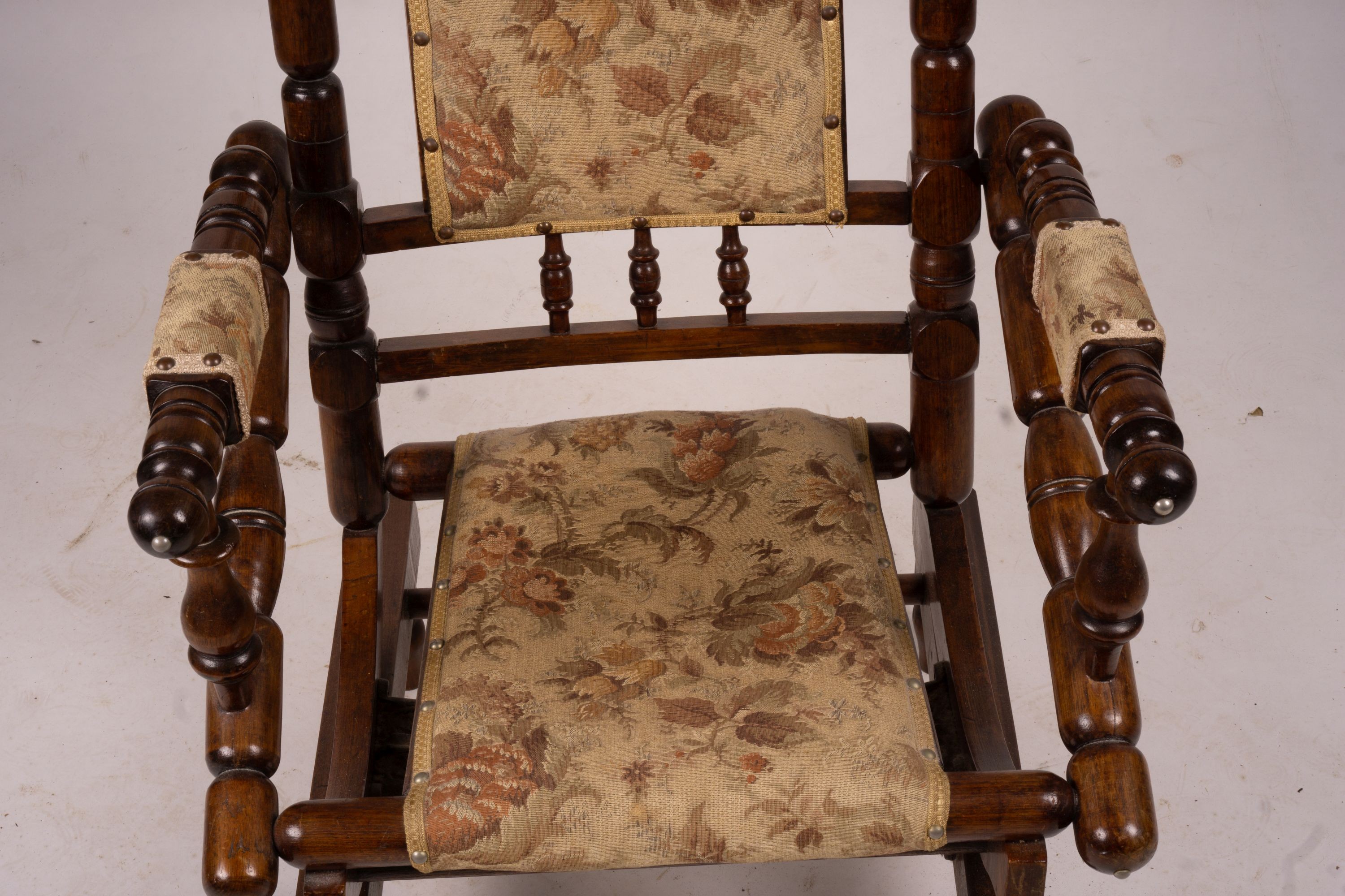 An early 20th century American turned mahogany rocking chair
